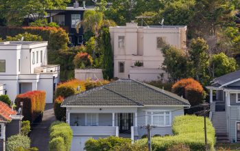 A wide image of different two stories houses.