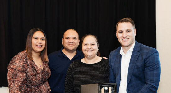 A close up of four people.