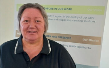 Close up of a person wearing a blue polar shirt.